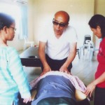 Massage Trainer from overseas demonsting massaging technique