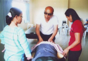 Massage Trainer from overseas demonsting massaging technique